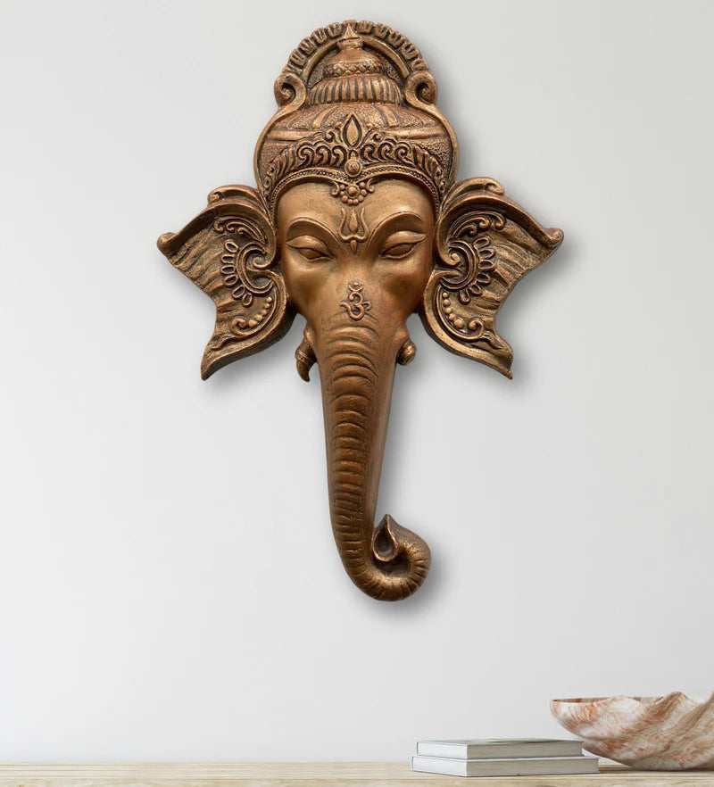 Decorative wall hanging of the Hindu god Ganesha featuring the iconic elephant trunk and ears symbolizing wisdom and spiritual significance